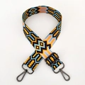 Detail view of woven geometric guitar strap with colorful patterns and metal hooks - Pattern D5-Gunmetal Buckle