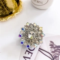 Close-up of luxury snowflake phone grip featuring sparkling rhinestones and AB crystals - Sunflower White - Textured Base