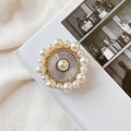 Detailed macro view of luxury pearl phone socket with rhinestone circle and sunburst pattern - No.8 Small Pearl / White