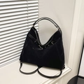 Minimalist large black suede tote bag with ribbon detail on a white window sill - Black