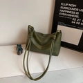 Dark green minimalist leather tote bag with a knotted strap and ethnic pattern crossbody strap - Green