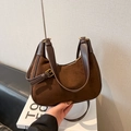 Chic brown suede crescent underarm bag with leather trim and gold metal hardware - Brown