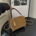 Chic brown suede shoulder bag with gold metal twist lock and sleek adjustable strap - Brown
