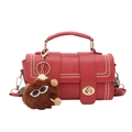 Red PU leather handbag with dual strap detail, metal twist lock, and plush doll charm - Red
