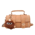 Retro brown leather handbag with gold metal clasp and cute brown plush monster charm - Brown