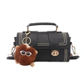 Retro black Boston cylinder bag with gold studs, lychee texture and monster charm - Black