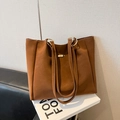 Deep brown leather tote bag featuring gold oval hardware and elegant top handles - No Pendant / Brown