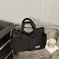 Minimalist black nylon tote bag with large capacity and multiple pockets for daily commute - Black