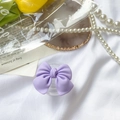 Detail shot of a matte purple bow phone socket grip on elegant vintage prop background - Transparent Stand-Large Bow-Purple