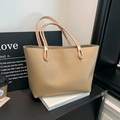 Minimalist large khaki tote bag with dual shoulder straps on a display shelf - Khaki