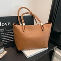Classic caramel tote bag in elegant leather texture for women, stylish commuter style - Brown