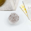 Macro view of round glitter phone socket with rose gold foil flakes inside clear resin - Epoxy Gold Foil Round / Brown