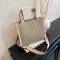 Retro tote bag with geometric clover pattern and wide shoulder strap on minimalist desk - Khaki