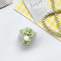 Cute green cartoon bear phone grip with heart-detailed paws and transparent base - Green
