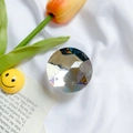 Expandable phone grip with a faceted clear crystal design on a vibrant spring background - White Large Round Rhinestone Holder