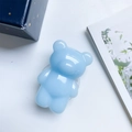 Light blue bear phone grip with transparent expandable air bag stand on white desk - Macaron Bear Holder / Blue