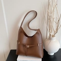 Minimalist large caramel leather tote bag with gold buckle and spacious interior - Brown