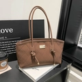 Brown quilted tote bag with gold metal plate and knot detail for elegant commuting - Quilted Brown