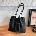 Minimalist black large capacity tote bag with matching pouch on a wooden tabletop - Black