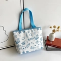 Borsa tote in tela bianca con stampe doodle blu e manici blu abbinati per donna - Azzurro