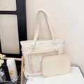 Creamy white ita bag with lace trim and clear window for badges in a lifestyle setting - Off White