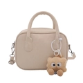 Elegant beige crossbody bag with a playful brown plush monster charm for casual wear - With Ornament / White