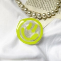 Detailed view of yellow smiley face phone grip with transparent retractable stand feature - Transparent Stand-Round Three-color Smiley-Light Green