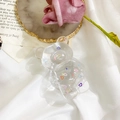 Transparent cartoon bear phone grip featuring colorful heart patterns on white fabric - Bear Grip - Random Laser Small Heart