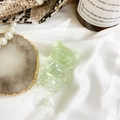 Cute translucent light green bear phone socket grip made of resin on a white fabric - Transparent Green