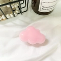Pink cloud-shaped collapsible phone socket grip with glossy finish on a soft fabric background - Pink