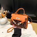 Luxury leopard print Kelly style handbag with orange leather trim and golden lock - Brown