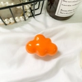 Glossy bright orange cloud phone grip socket on elegant white silk background - Orange