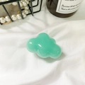 Mint green cloud phone socket grip with glossy finish on aesthetic white fabric - Green