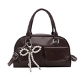Deep brown faux leather bowling bag with pearl bow charm and double front pockets - Brown