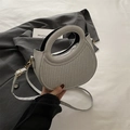 Silver-grey half-moon handbag with vertical striped texture and round cutout handle - Silver