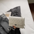 Elegant white quilted crossbody bag with gold chain strap and top handle design - White