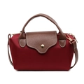 Burgundy nylon crossbody bag with brown leather flap and golden button on white background - Burgundy