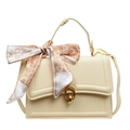 Cream vintage handbag with golden oval lock and decorative silk scarf accessory - Yellow