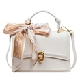 White faux leather top handle bag with gold oval lock and decorative silk scarf detail - White