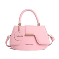Pink semi-circular faux leather handbag for women with fashion pendant and long strap - Pink