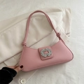 Chic pink baguette bag with crystal buckle and knotted strap on blazer background - Pink