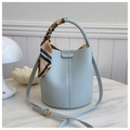 Litchi pattern light blue bucket bag with silk scarf handle and golden hardware - Blue