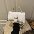 Elegant white quilted shoulder bag with golden H-clasp and versatile handle strap - White
