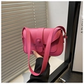 Detail of bright pink crossbody bag featuring gold hardware and magnetic flap closure - Rose Pink