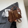 Elegant dark brown leather tote with woven texture, golden buckle and silk scarf handle - Brown