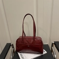 Deep red high-gloss bowling shoulder bag with long handles and decorative side pocket - Red
