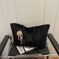 Vintage black leopard print tote bag with plush charm on a minimalist leather chair - With Pendant / Black