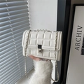 Chic white quilted shoulder bag with silver chain strap and metal rotary lock clasp - White