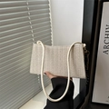 Detail of beige woven tote bag with herringbone pattern and decorative silk scarf - With Pendant / Off White