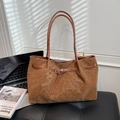 Brown leopard print suede tote bag with leather straps on a black leather bench - Brown No Pendant